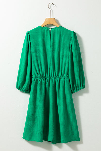 Mini-robe de couleur unie à col rond et manches bouffantes vert foncé