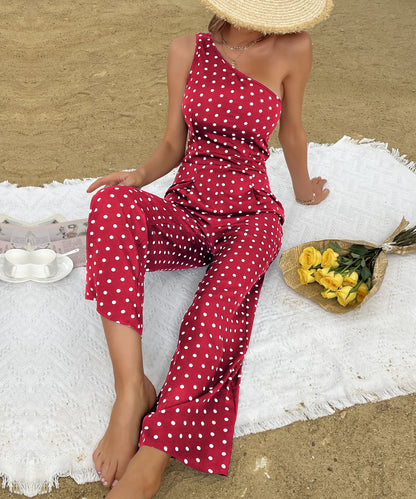 Sommerlicher Jumpsuit mit gepunkteter Bootcut-Hose, eine Schulter, weites Bein