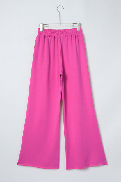 Rosa elastische Jogginghose mit hohem Bund und weitem Bein und Taschen