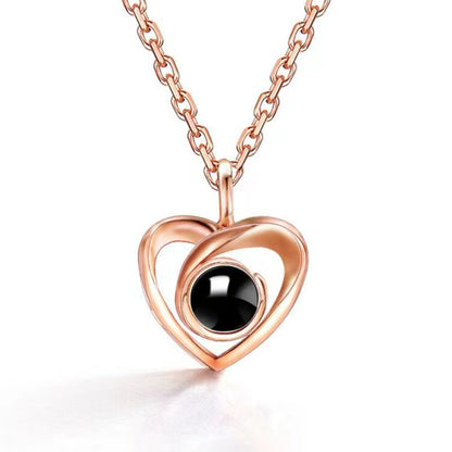 Fashion simple hollow heart projection necklace