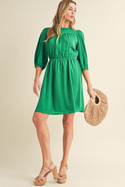 Mini-robe de couleur unie à col rond et manches bouffantes vert foncé