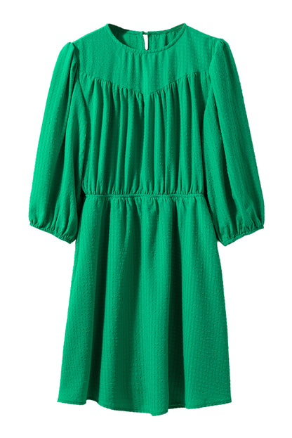 Mini-robe de couleur unie à col rond et manches bouffantes vert foncé