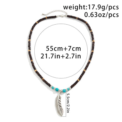 Collier pendentif en perles de bois mosaïque et turquoise avec plumes, exquis et tendance