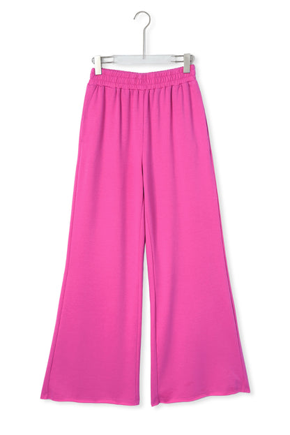 Rosa elastische Jogginghose mit hohem Bund und weitem Bein und Taschen