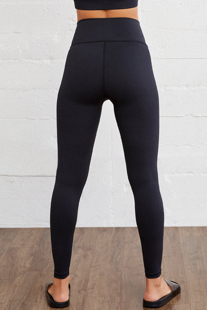 Legging actif sans couture noir à taille arquée