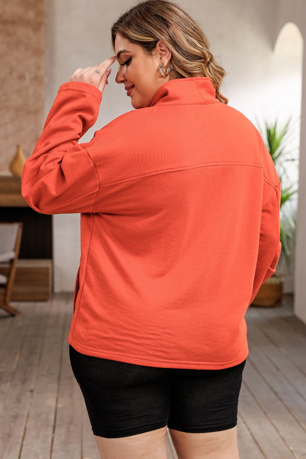 Orangefarbenes Sweatshirt mit O-Ring-Reißverschluss und Taschen in Übergröße