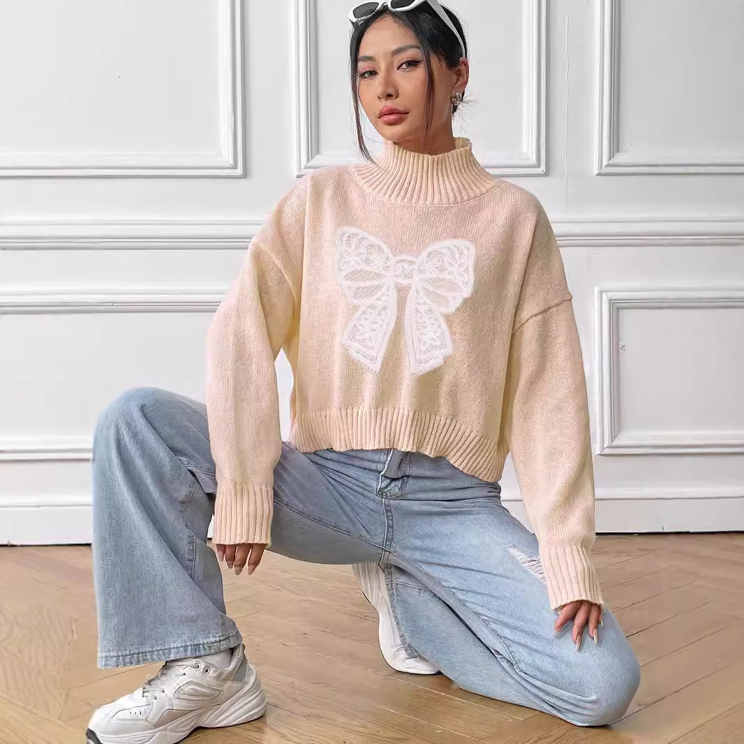 Pull court à col roulé et nœud pour femme