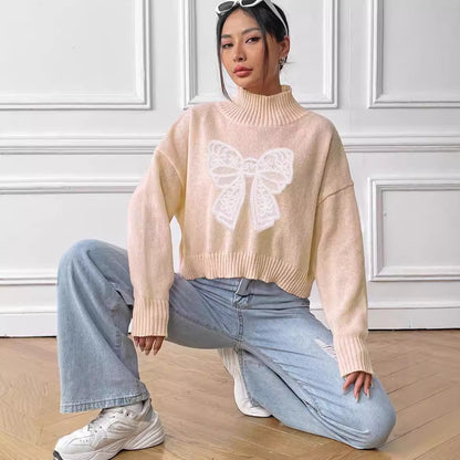 Pull court à col roulé et nœud pour femme