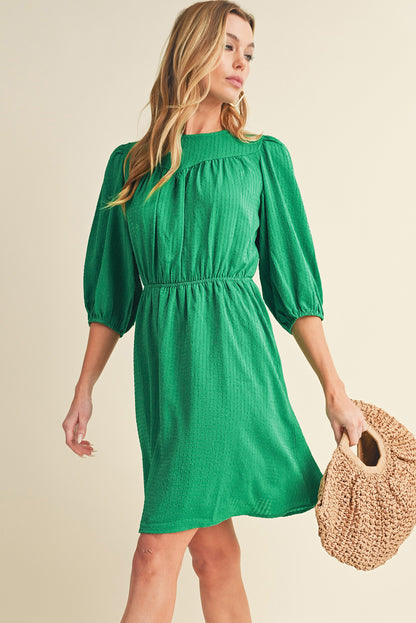 Mini-robe de couleur unie à col rond et manches bouffantes vert foncé