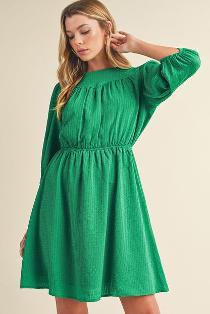 Mini-robe de couleur unie à col rond et manches bouffantes vert foncé