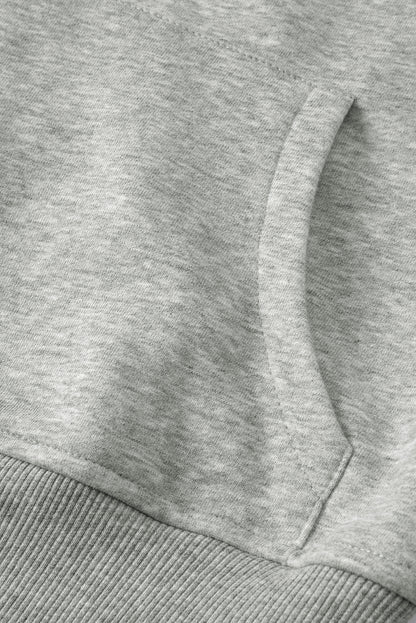 Grünes Sweatshirt mit Stehkragen und gerippten Daumenlöchern und Reißverschluss