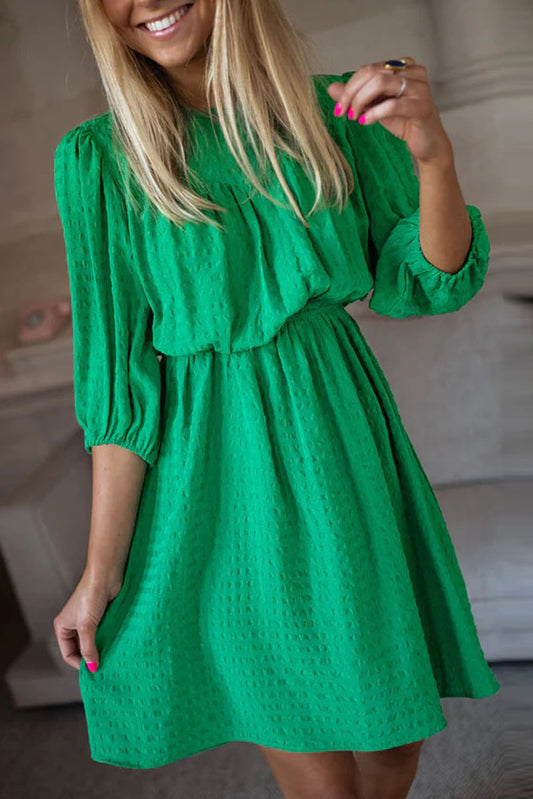 Mini-robe de couleur unie à col rond et manches bouffantes vert foncé