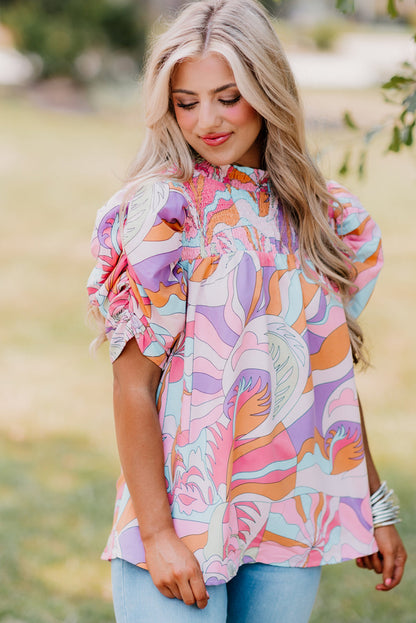 Blouse smockée rose à manches bulles et imprimé abstrait