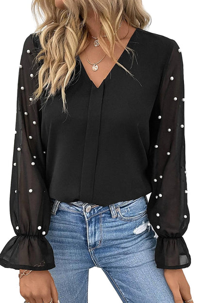 Blouse noire à col en V et manches en maille perlée