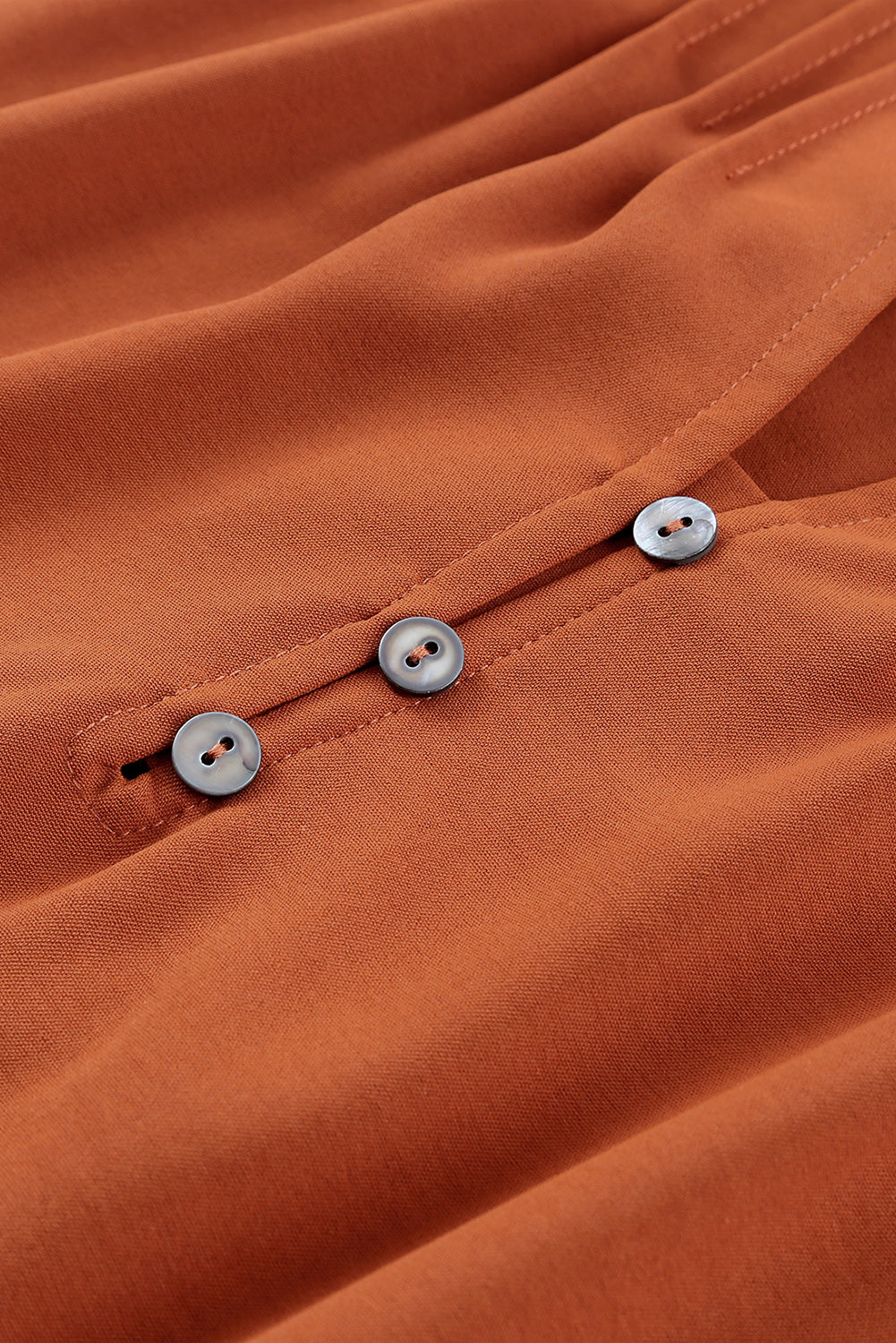 Blouse orange plissée à volants et boutonnée à col en V