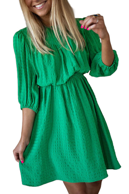 Mini-robe de couleur unie à col rond et manches bouffantes vert foncé