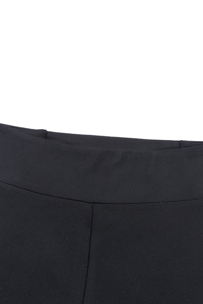 Schwarze, überkreuzte, bauchkontrollierende Leggings mit hoher Taille