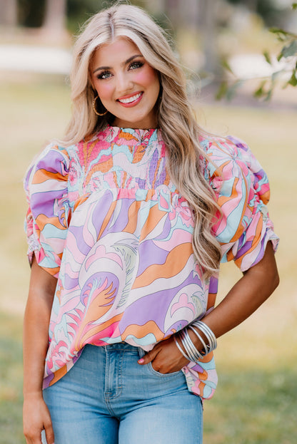 Blouse smockée rose à manches bulles et imprimé abstrait