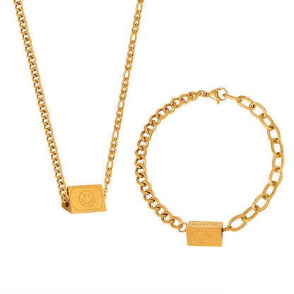 18K gold novel and fashionable tapered bracelet and necklace set with smiley face and "Smile" design