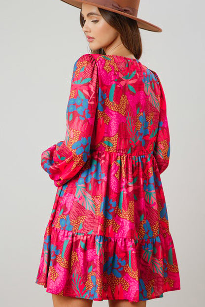 Rosa fließendes Boho-Blumenkleid mit V-Ausschnitt und Blasenärmeln