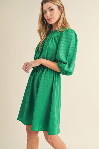 Mini-robe de couleur unie à col rond et manches bouffantes vert foncé