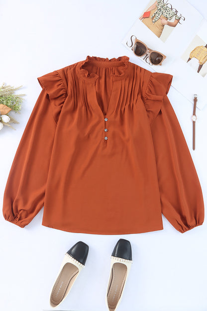 Blouse orange plissée à volants et boutonnée à col en V