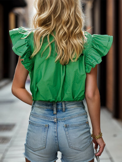 Blouse à volants et mancherons crantés