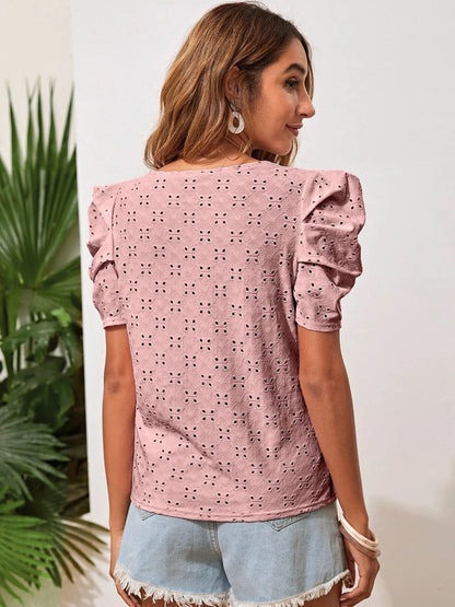 Blouse à œillets et col rond à manches bouffantes