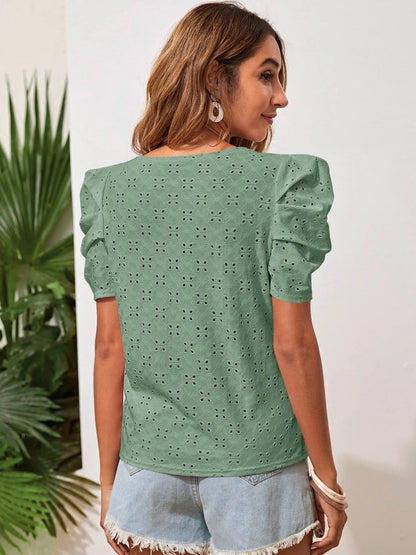 Blouse à œillets et col rond à manches bouffantes